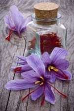 Saffron Flowers Next To Jar Of Herbs