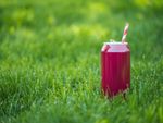 Red Soda Can On Green Grass