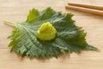 Wasabi On A Leaf Next To Chopsticks