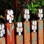 Flowers Painted On A Garden Fence