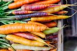 Multicolored Carrots In Wooden Basket