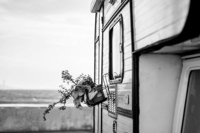 RV With A Hanging Plant Potter Full Of Flowers