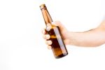 Hand Holding A Glass Beer Bottle