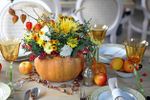 Flowers In A Pumpkin As A Thanksgiving Dinner Centerpiece