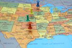Four Tacks Pinned On A Map Of The United States