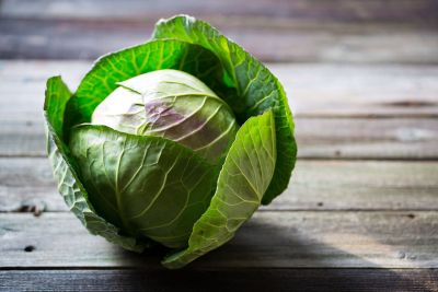 Single Cabbage On Wooden Table