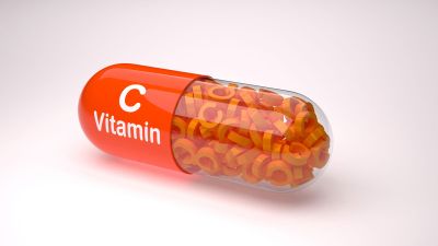 Capsula di vitamina C arancione