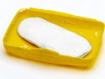 White Bar Of Soap In A Yellow Container