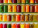 Glass Jars Full Of Canned Fruits And Vegetables
