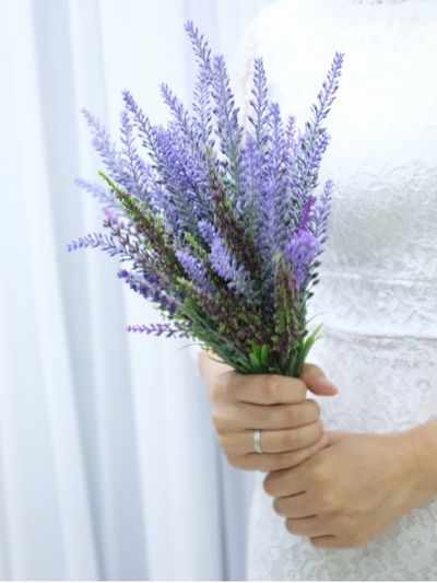 Bride Holding A Purple Herbal Bouquet