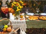 Backyard Thanksgiving Dinner Table Full Of Food And Decor