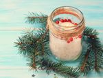 DIY Homemade Christmas Candle Surrounded By Pine Stems