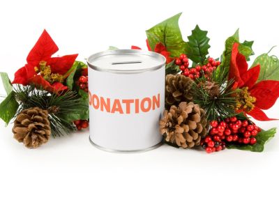 Donation Can Surrounded By Holiday Christmas Decor