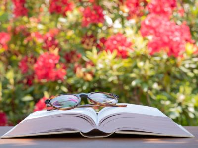 Glasses On A Book In A Garden