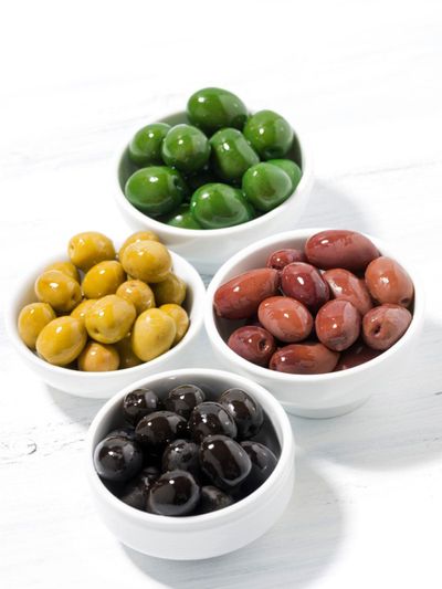 Dishes Full Of Different Colored Olives