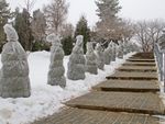 Path Of Outdoor Trees Covered With Plastic To Protect From Snow