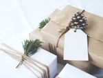 Paper Wrapped Presents Decorated With Pine Cones And Fir Branches