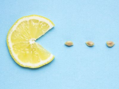 A Slice Of Lemon And Lemon Seeds