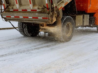 Truck Dropping Salt On Wintry Road