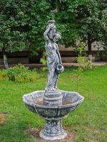 Fountain Statue In The Garden As The Focal Point