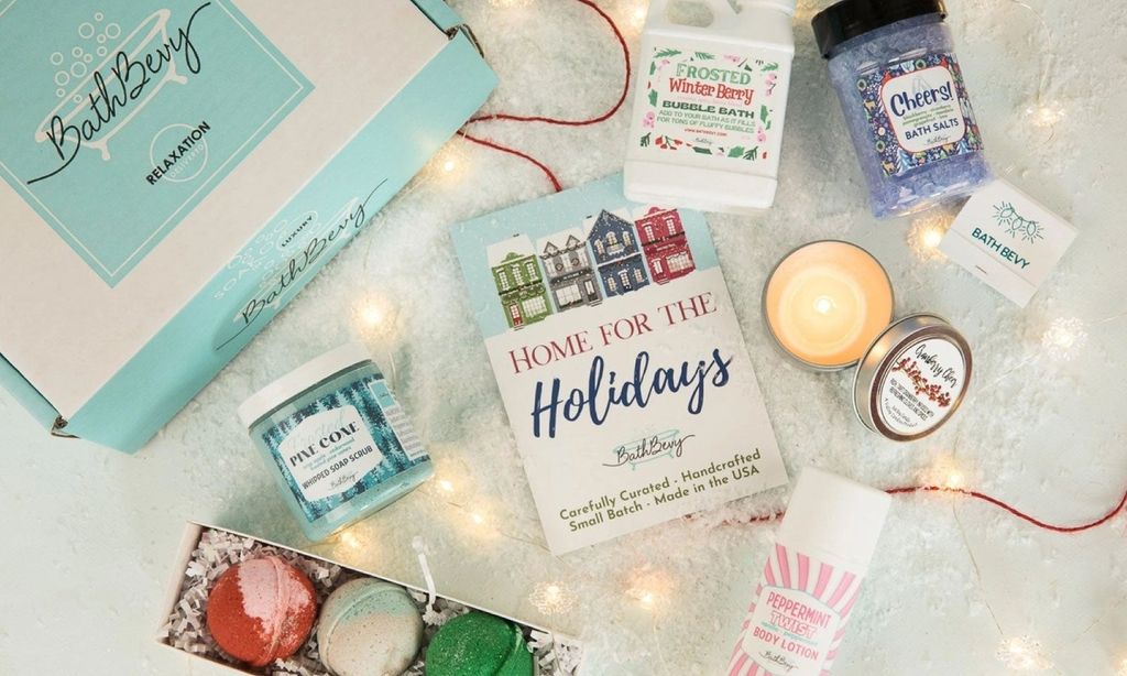 A holiday themed box with holiday-inspired bubble bath, bath salts, bath bombs, and soaps