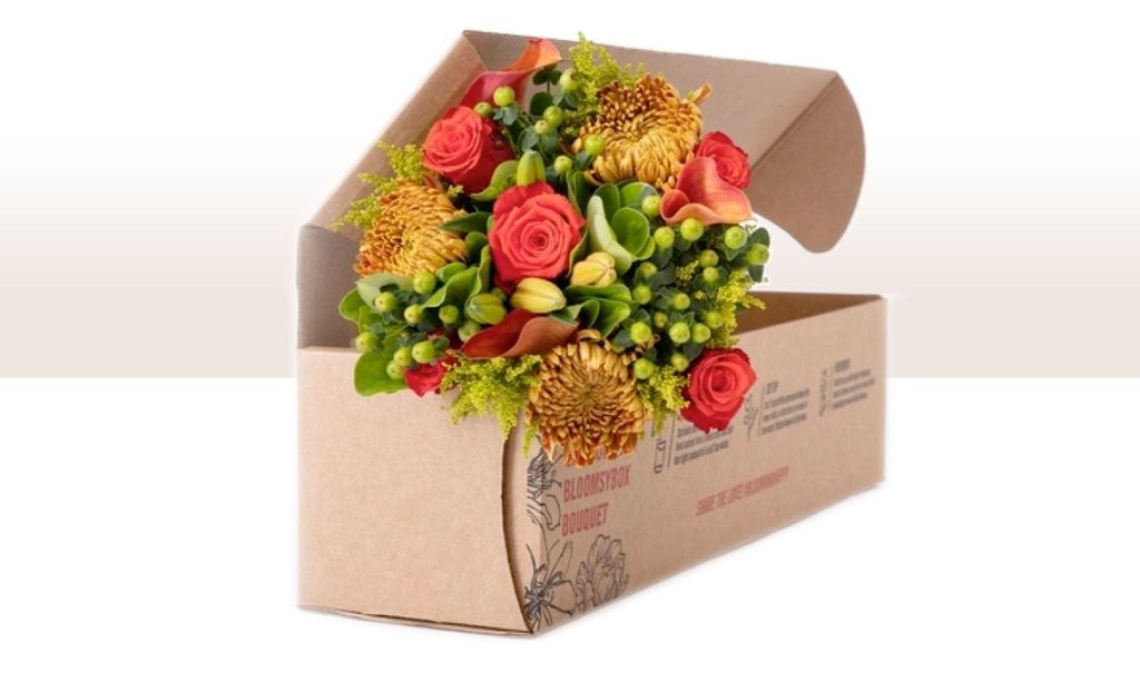 A bouquet inside a cardboard box