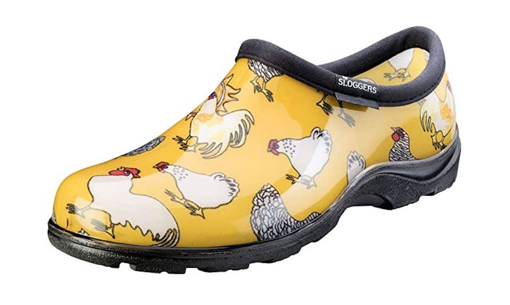 Yellow waterproof clogs with a rooster pattern.