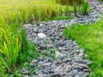 A permaculture swale made of stone