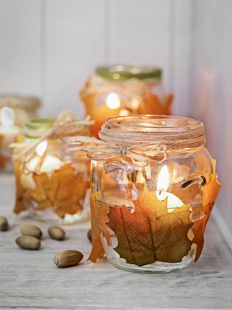 Glass candle holders decoupaged with autumn leaves